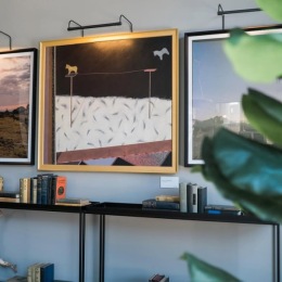At The Alfred, thoughtful decor and art elevate every moment at home art on a wall