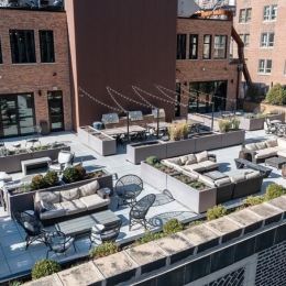 Take your hangouts to new heights at @thealfred.flats! a terrace with tables and chairs