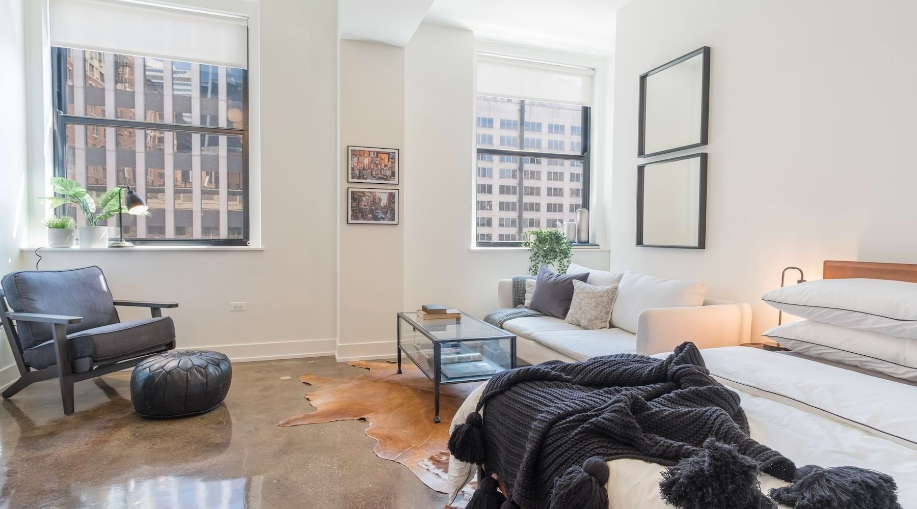 Loop Life Awaits living room with a large window and open spaces
