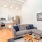 airy floorplan with comfy couch in downtown Chicago apartment building - The Alfred