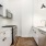 galley kitchen with countertop open to living room