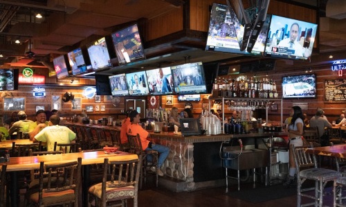 sports bar restaurant with screens and fans - restaurants sports bar