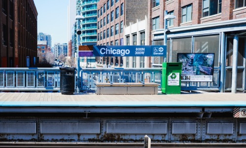 CTA Blue Line train arriving at a station platform
